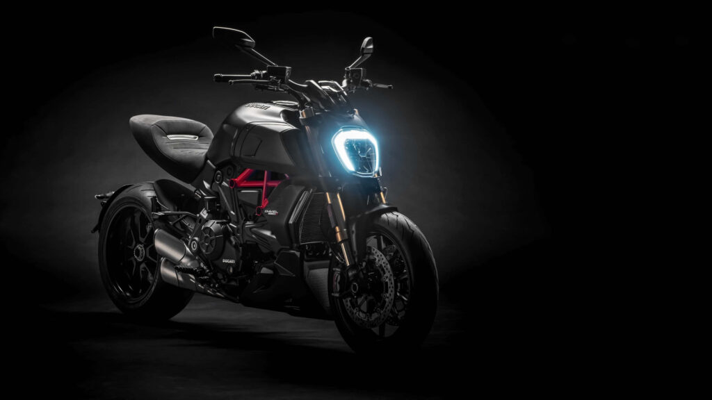 Sleek Modern Motorcycle Wallpaper: Sharp Design on Dark Background