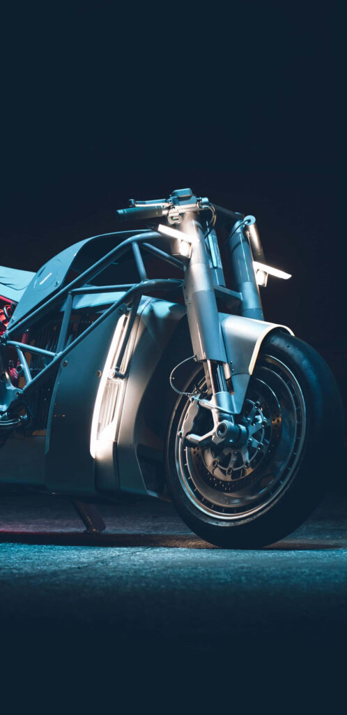 Sleek Motorcycle Wallpaper: Modern Design in Dim Lighting