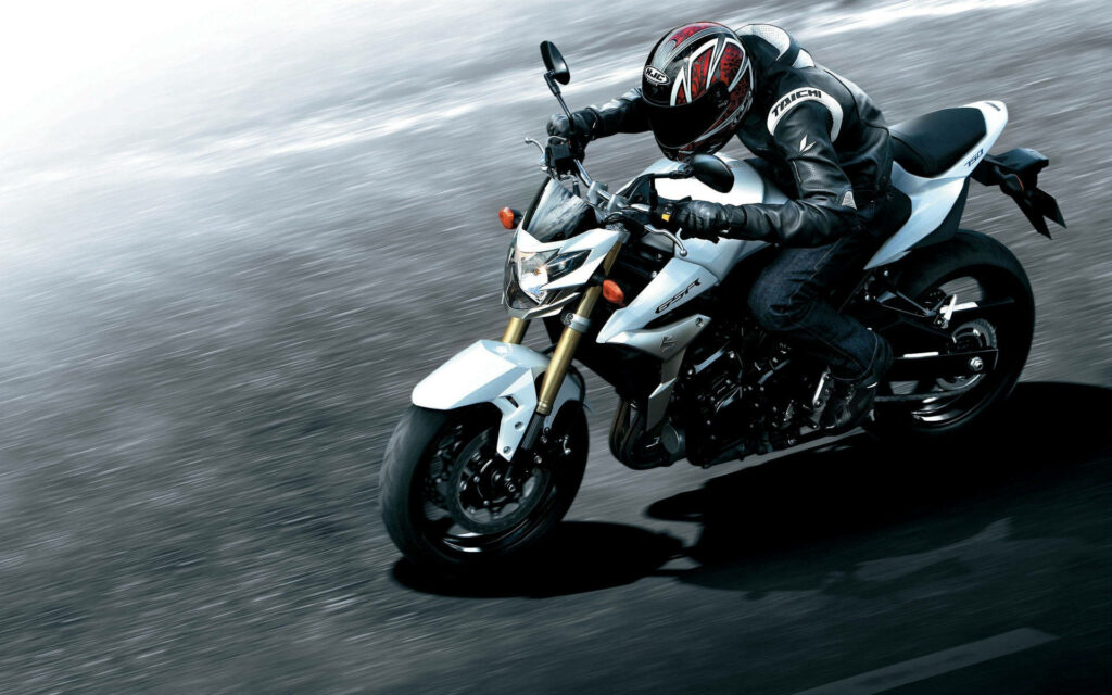 Sleek Motorcycle in Action: High-Octane Wallpaper Background