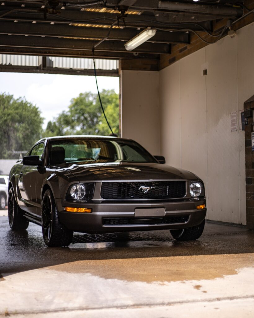 Mustang Wallpaper: Iconic Grille & Sleek Design in Stunning Light