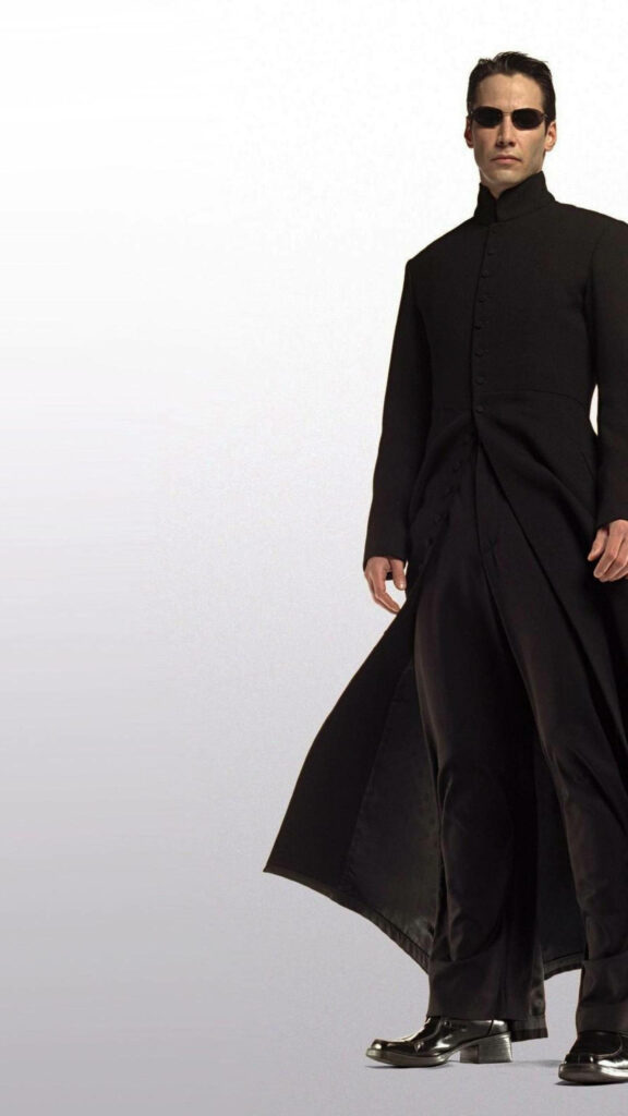 Sleek Matrix Wallpaper: Keanu Reeves as Neo in Iconic Black Coat