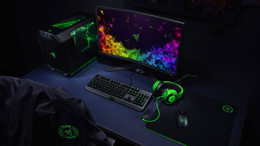 Sleek gaming room wallpaper with neon green Razer PC and mechanical keyboard in dark setup