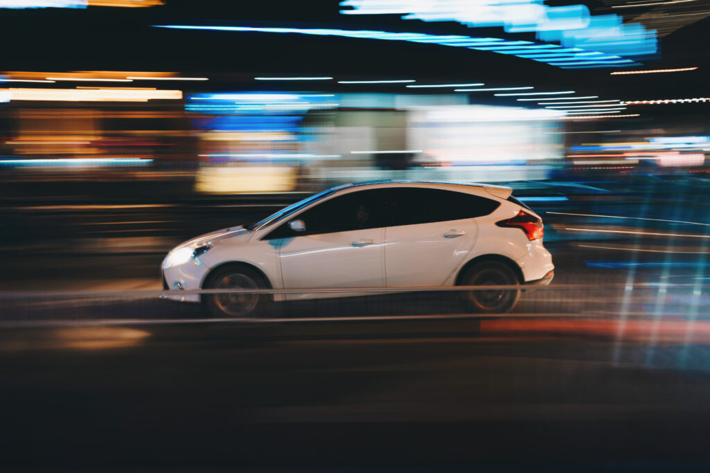 Sleek Car Racing at Night - Dynamic Wallpaper with Motion Blur