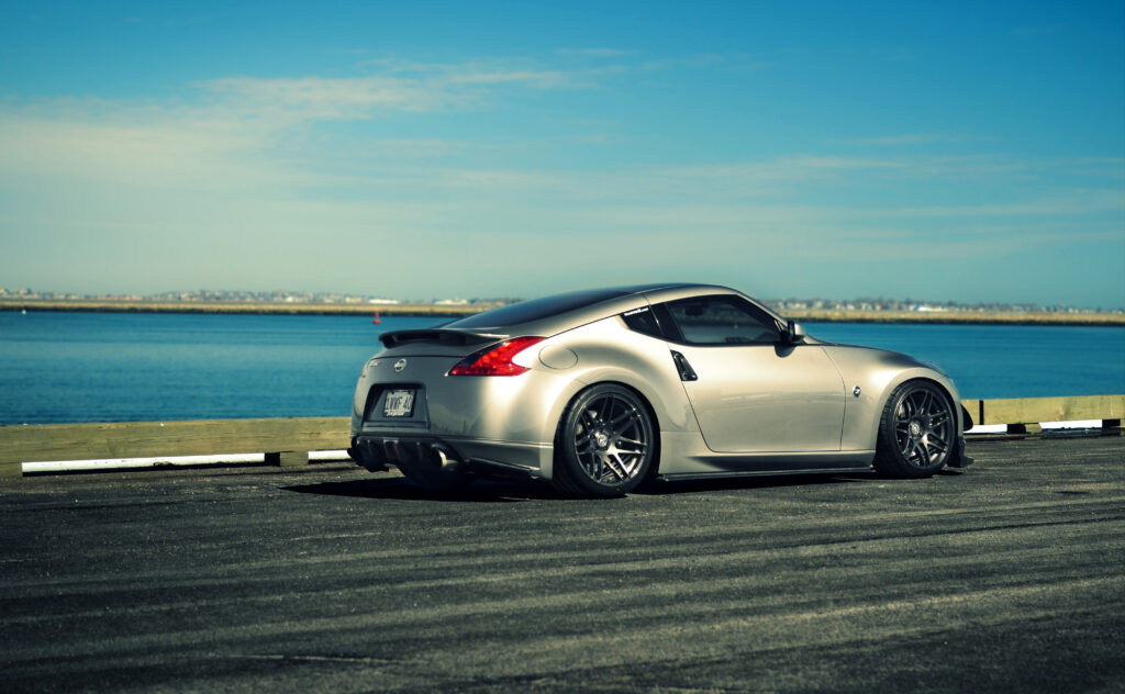 Nissan 370Z Side View Wallpaper at Serene Waterfront – JDM Style