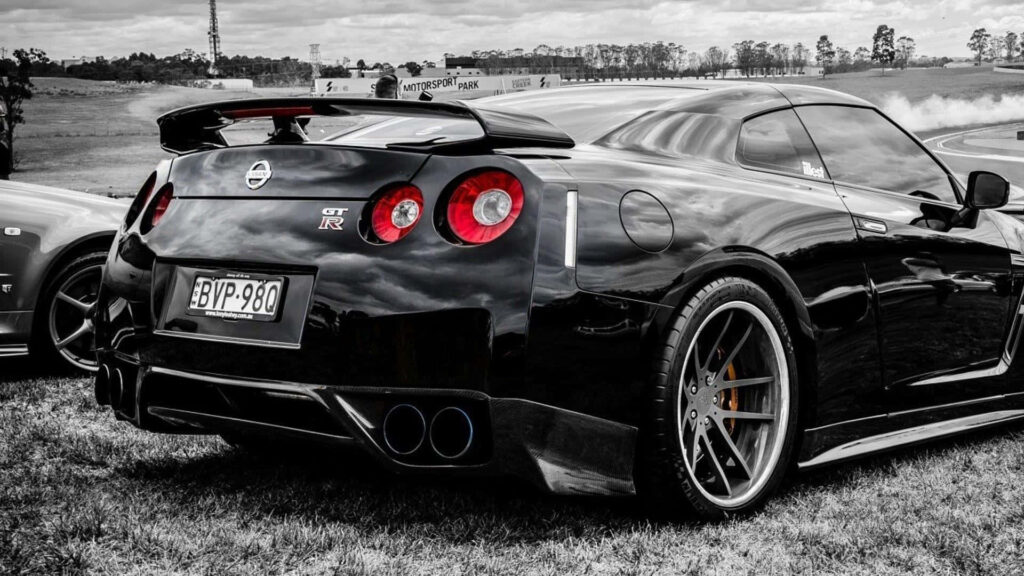 Sleek Nissan GT-R Wallpaper: Bold Design & Scenic Outdoor View