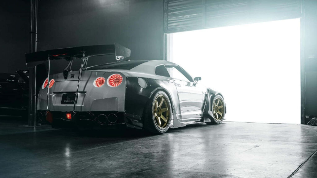 Sleek Nissan GT-R in Dim Garage | Dynamic Wallpaper Background