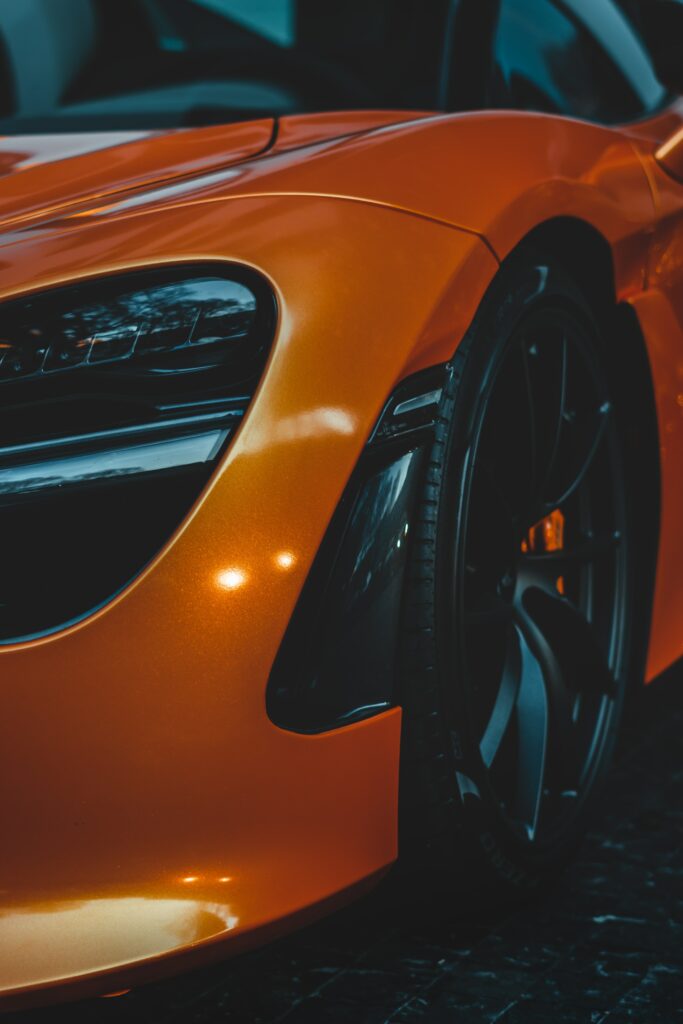 Sleek Orange Sports Car Wallpaper: Luxury & Performance Showcase