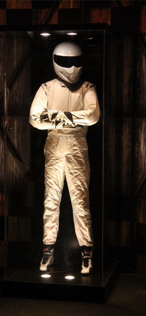 Sleek Phone Wallpaper: Racing Suit Figure in Glass Display - Stylish Background