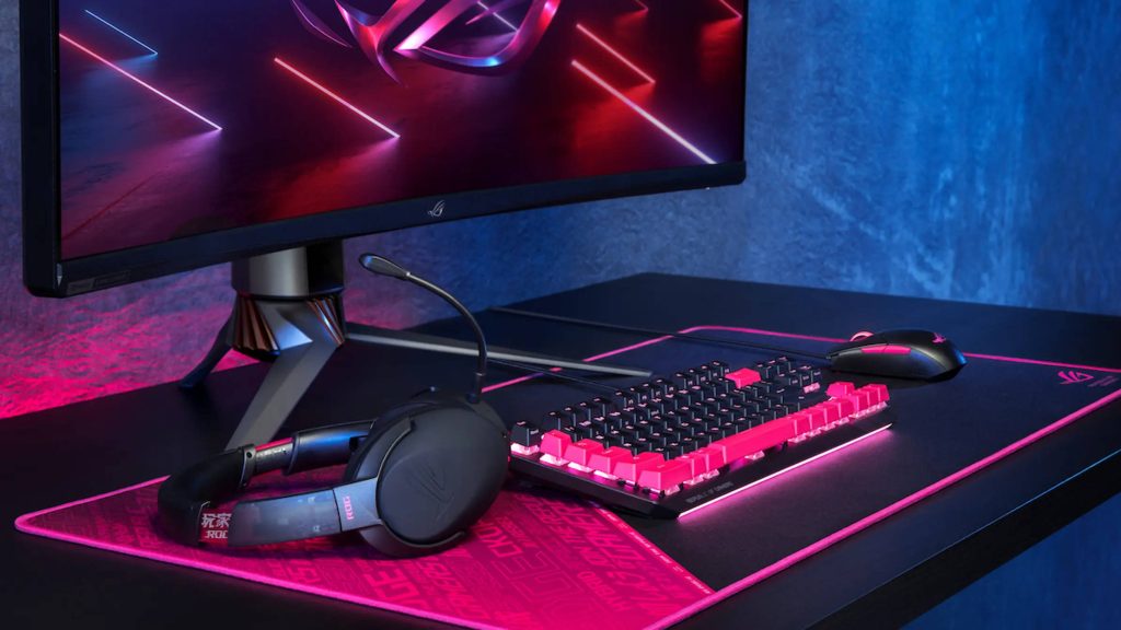 ASUS ROG gaming desktop with pink black mechanical keyboard headset custom desk mat neon lighting Wallpaper
