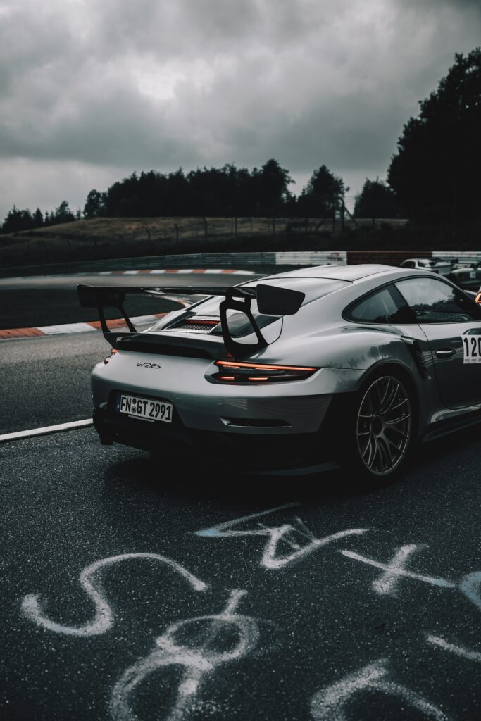 Sleek Porsche 911 GT2 RS on Racetrack: Speed & Performance Wallpaper