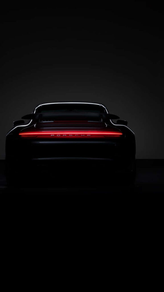 Sleek Porsche 911 Wallpaper: Elegant Rear View with Red Tail Lights