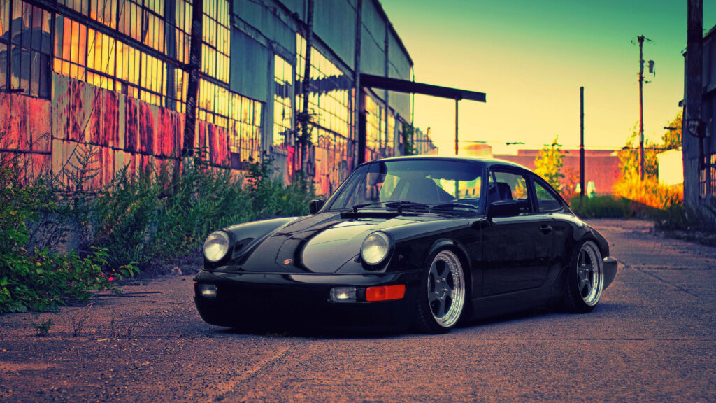 Sleek Porsche 911 Wallpaper: Sporty Elegance in Urban Settings