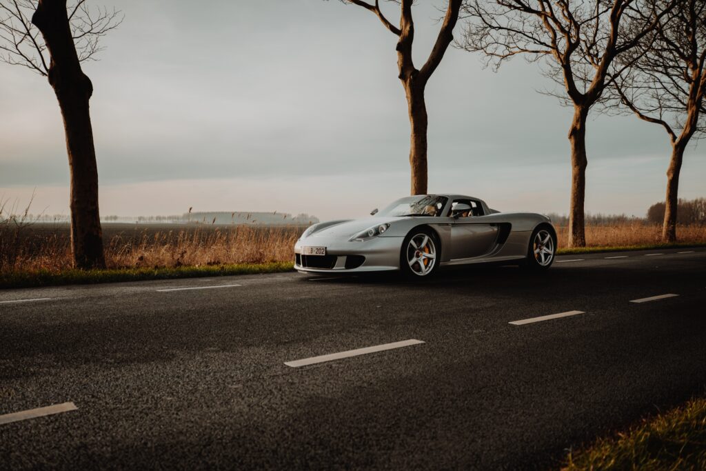 Sleek Porsche Sports Car Wallpaper: Freedom & Elegance in Nature