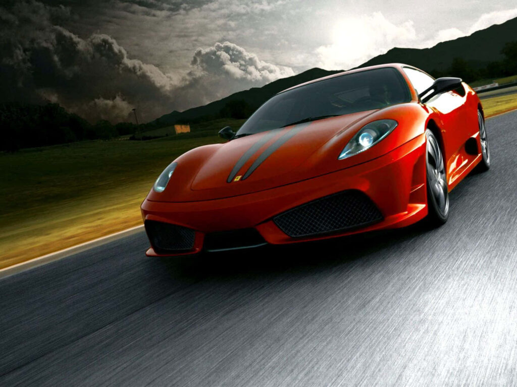 Power Unleashed: The Red Ferrari F430 Roars on the Racetrack Wallpaper