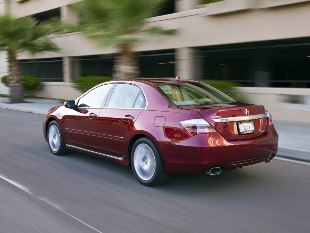 Sleek Red Acura RL Sedan Wallpaper - Dynamic Rear View & Modern City