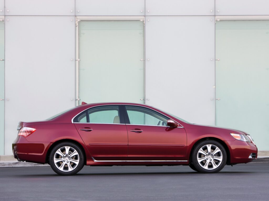 Sleek Red Acura RL Side View Wallpaper with Minimalist Background