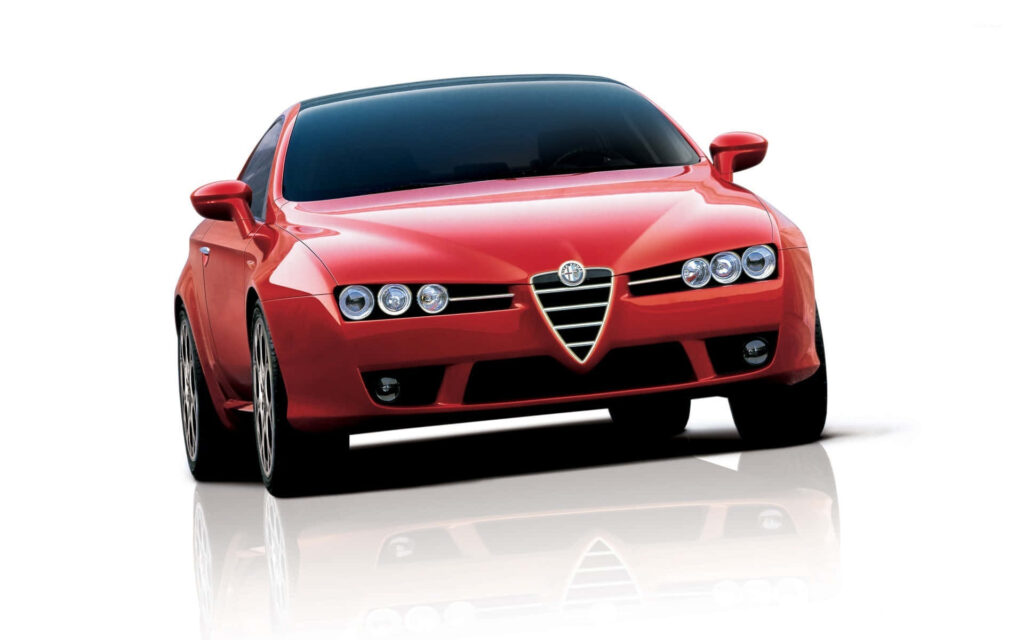 Alfa Romeo Brera red sports car with sleek Italian design on white background wallpaper