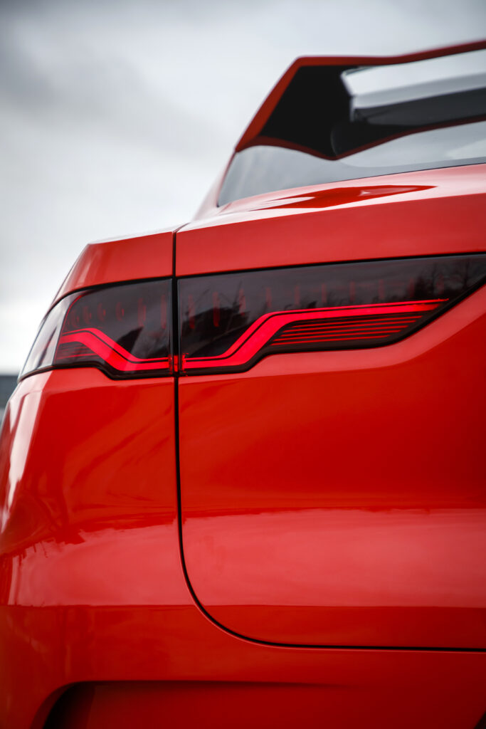 Close-Up of a Sleek Red Car's Modern Taillight Design Wallpaper