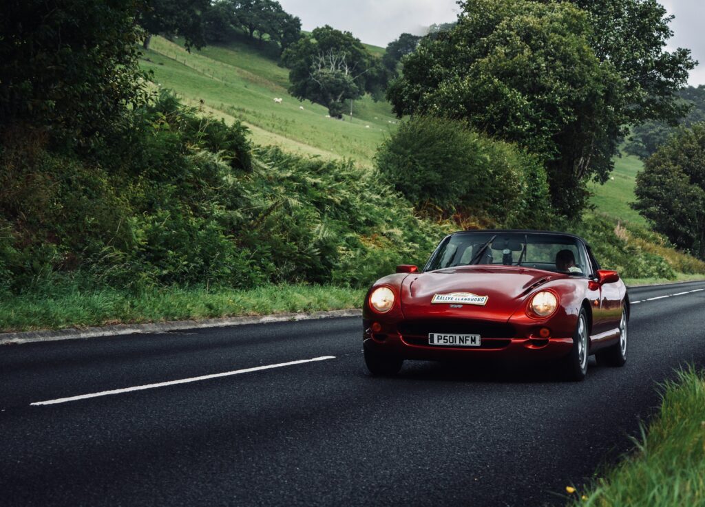 Red Convertible on Open Road: Adventure Wallpaper for Car Lovers