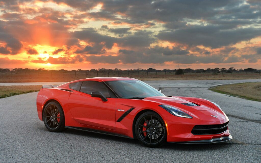 Sleek Red Corvette Stingray: Sunset Background & Luxury Design Wallpaper