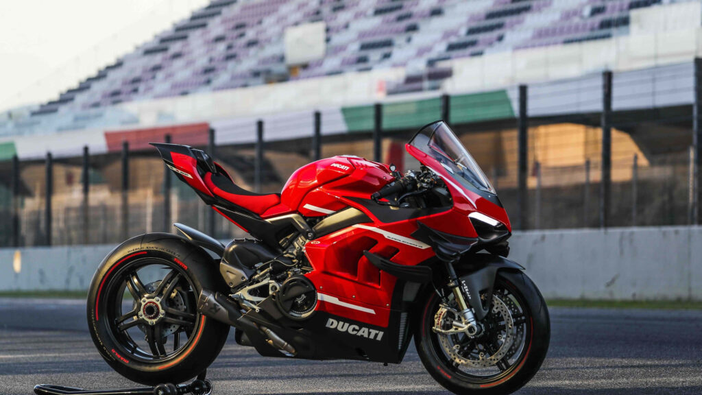 Red Ducati Motorcycle Wallpaper: Sleek Design on Racetrack