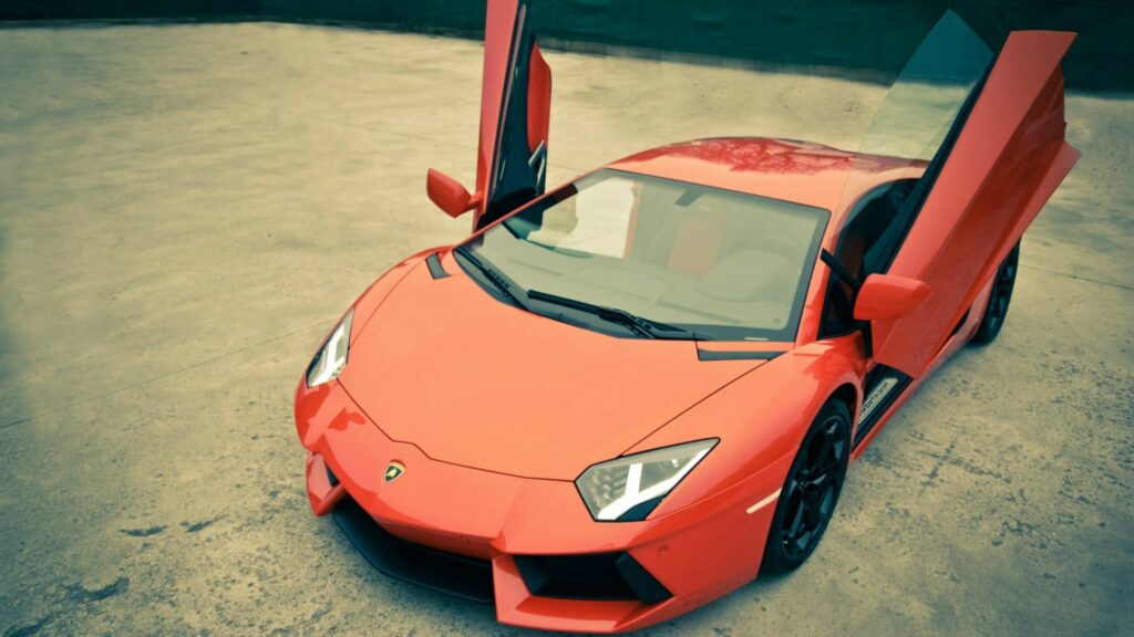 Sleek Red Lamborghini Wallpaper: Scissor Doors, Minimalist Background