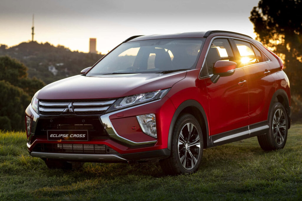 Sleek Red Mitsubishi Eclipse Cross Wallpaper at Sunset - Modern Design