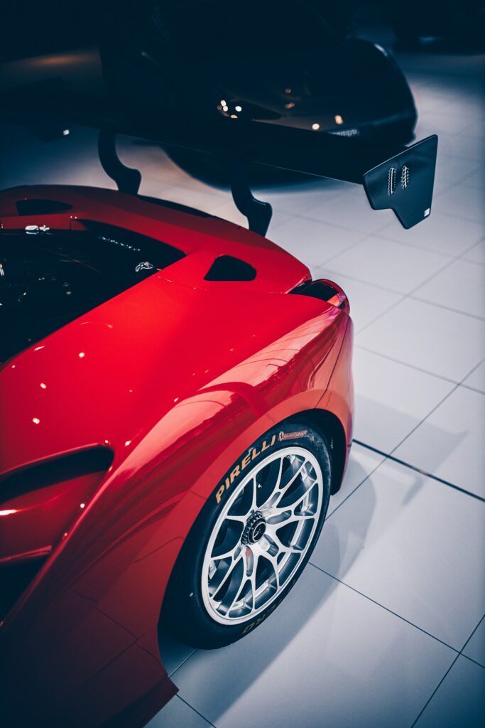 Glossy Red Sports Car Wallpaper: Aerodynamic Design & Speed