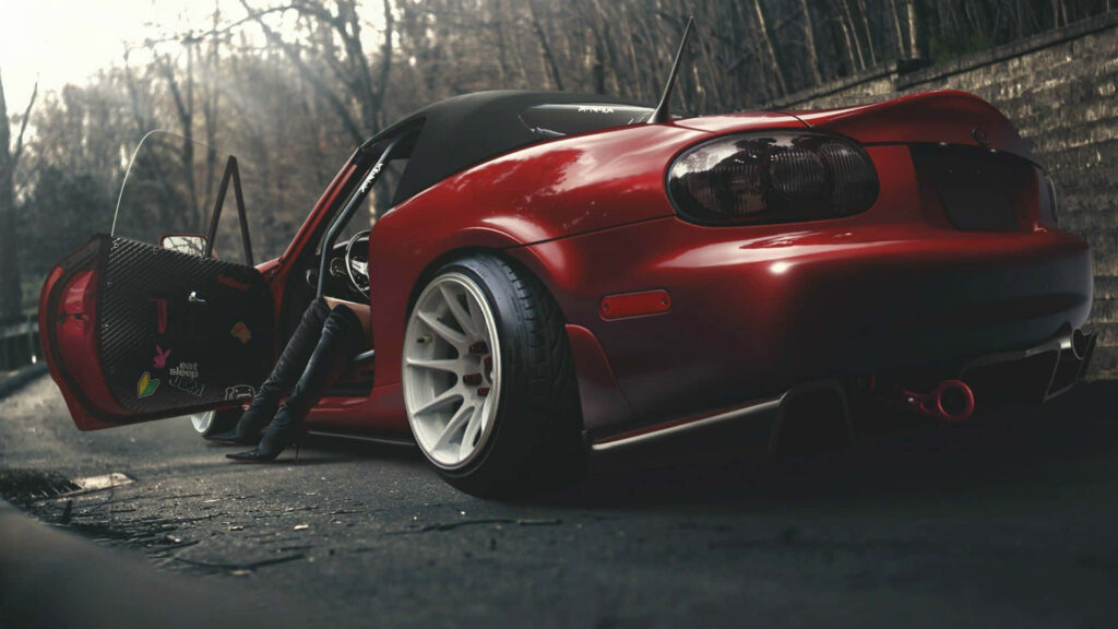 Sleek Red Sports Car Wallpaper - Modern Design & Moody Urban Vibes