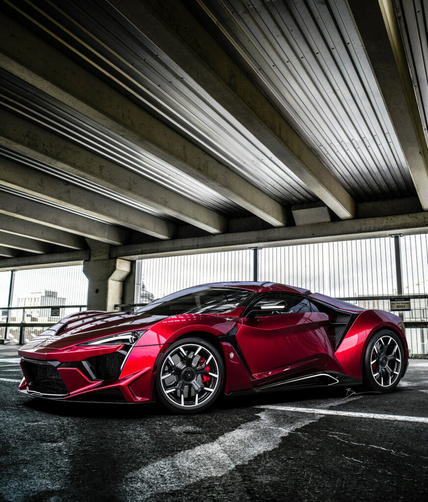 Red Supercar Wallpaper: Aerodynamic Luxury in an Industrial Setting