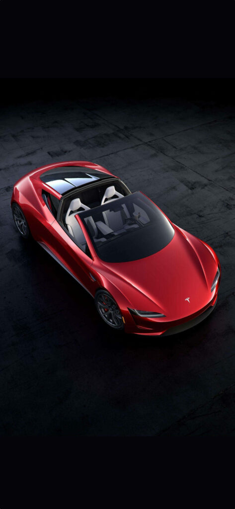 Sleek red Tesla Roadster on dark textured surface futuristic iPhone car wallpaper background