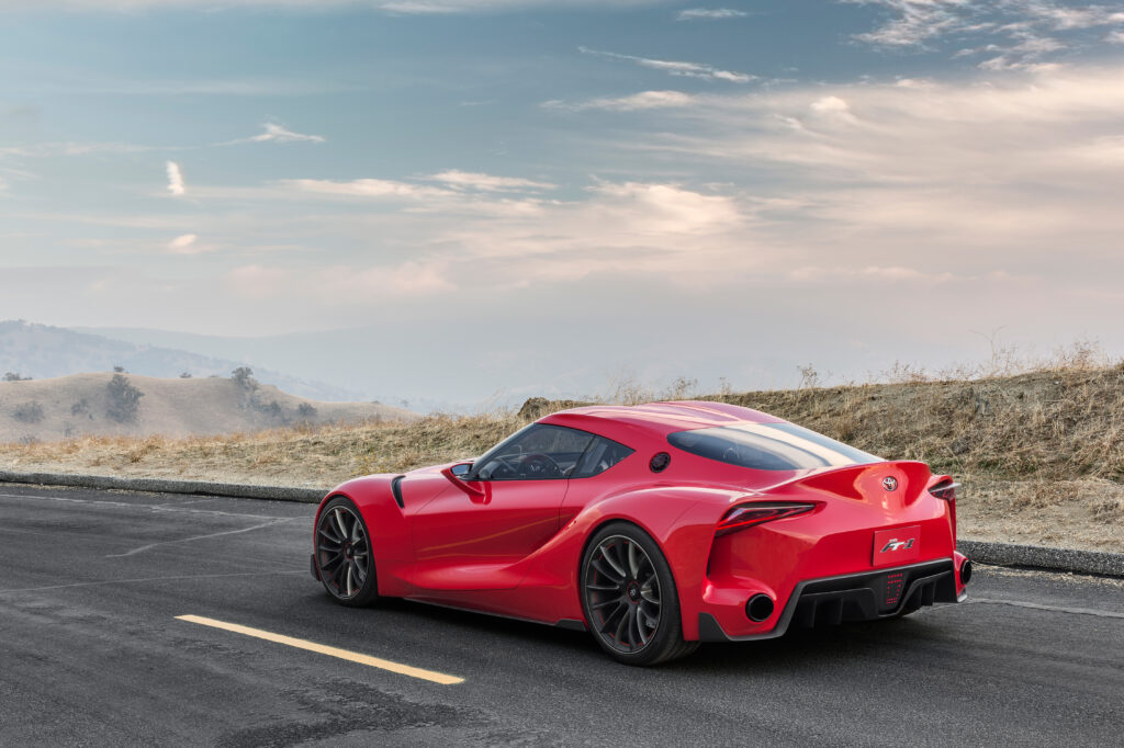 Red Toyota FT-1 Wallpaper: Sleek Design & Scenic Background