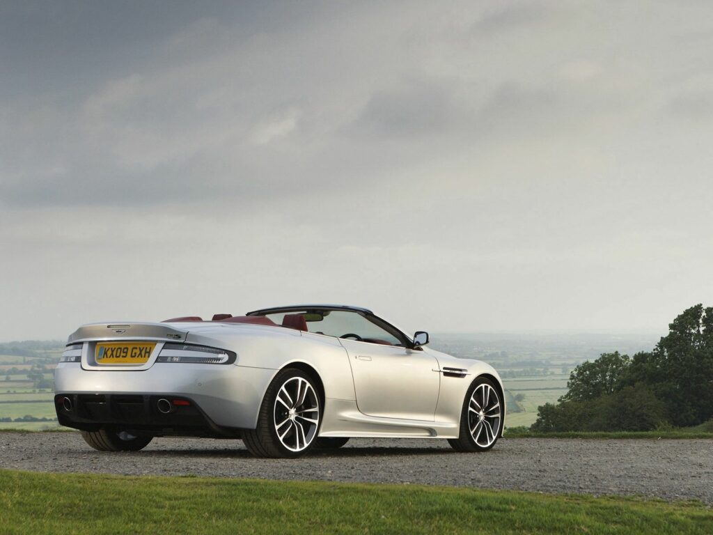 2009 Aston Martin DBS: Sleek Silver in Serene Natural Background Wallpaper