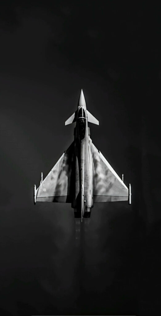 Sleek Silver Fighter Plane Wallpaper: Dark Aerodynamic Background