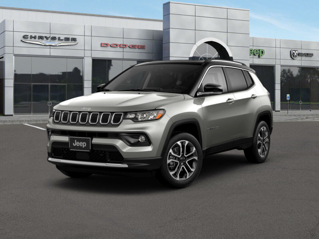 Silver Jeep Compass parked outside modern building showcasing stylish urban SUV exterior design Wallpaper