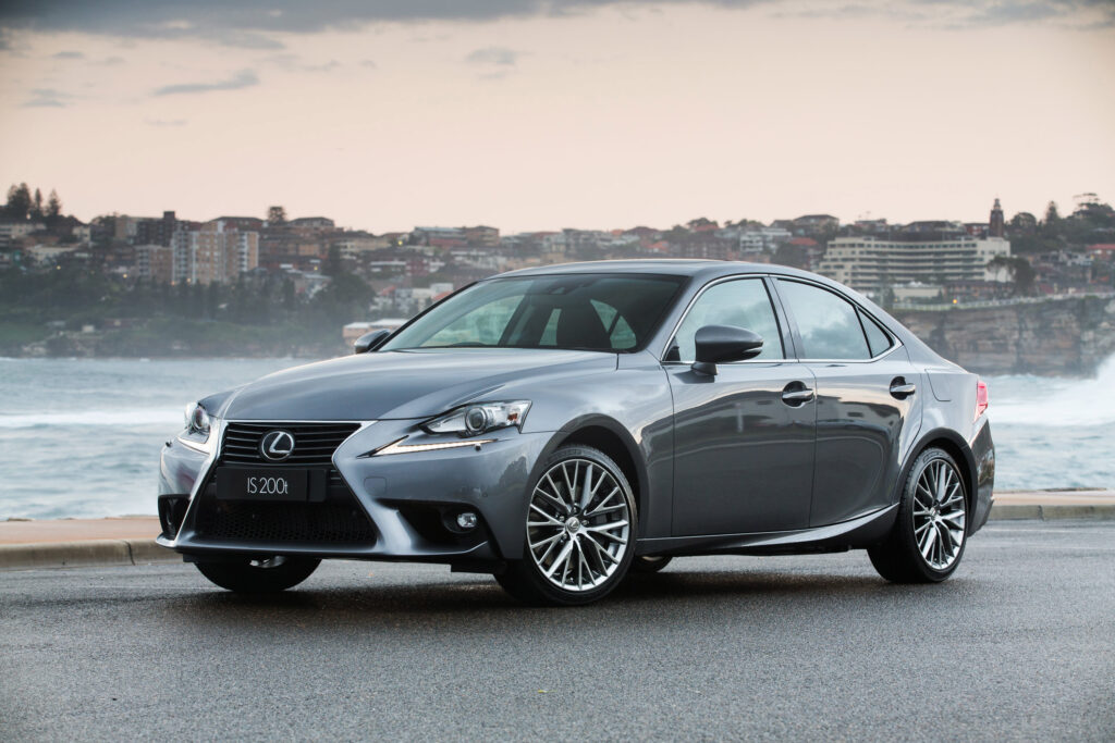Elegant Silver Lexus IS 200t Side View Wallpaper with Coastal Background
