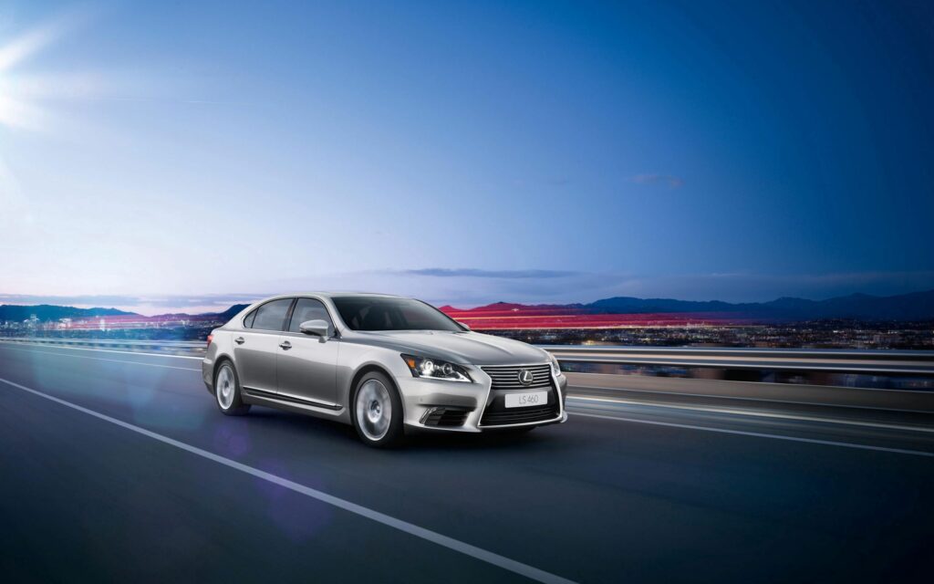 Sleek Silver Lexus LS-EU: Dynamic City Wallpaper Background