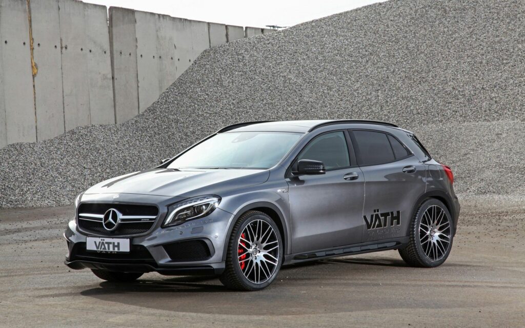 Silver Mercedes-Benz GLA-Class X156: Sporty Elegance on Gravel Background Wallpaper