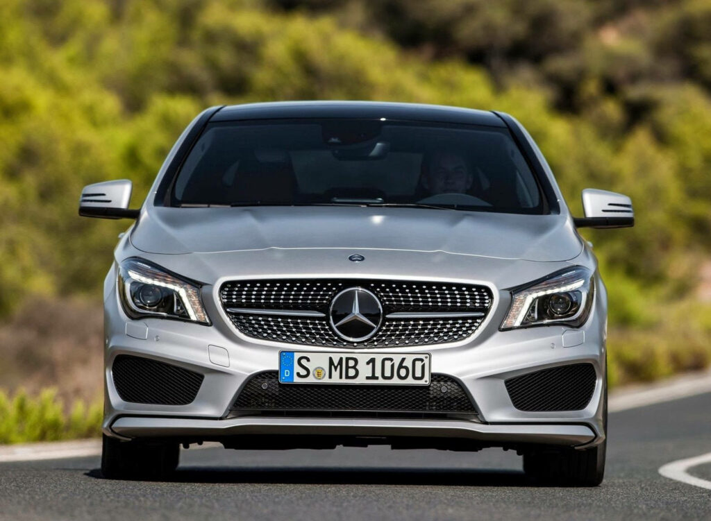 Silver Mercedes-Benz SUV front view with bold grille and elegant design outdoors wallpaper