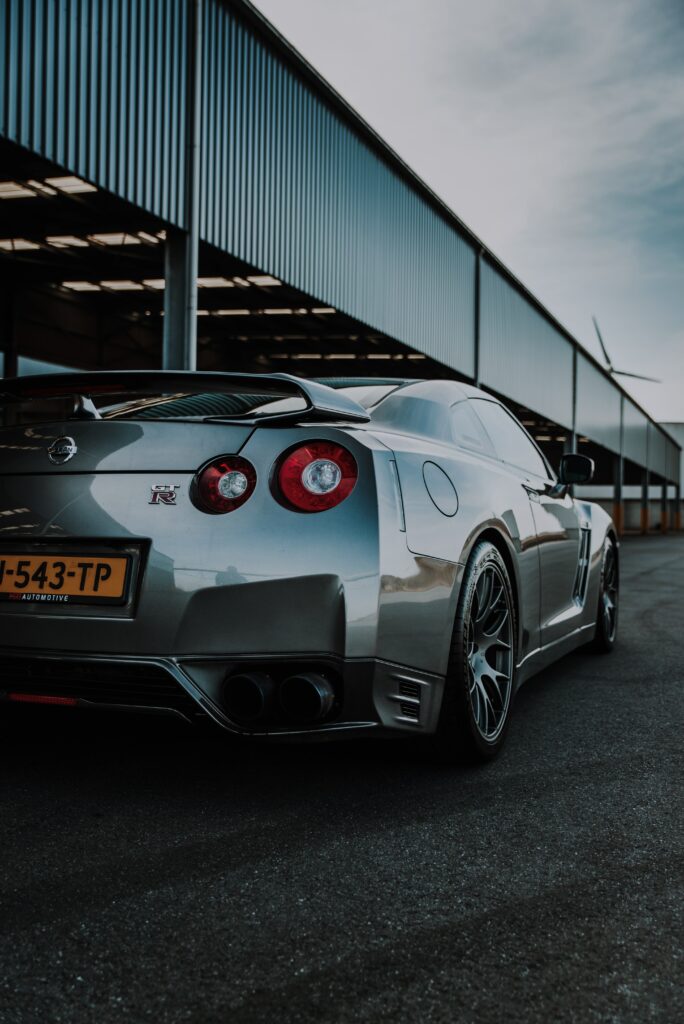 Sleek Silver Nissan GT-R in Industrial Setting - High-Res Wallpaper