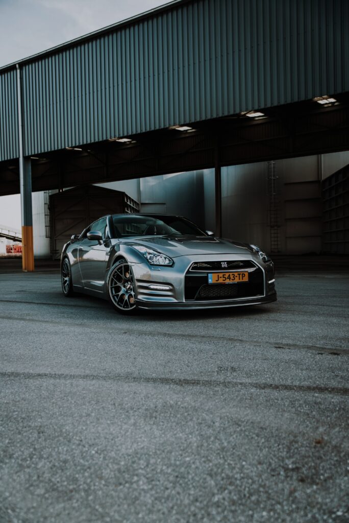 Sleek Silver Nissan GT-R Wallpaper - Powerful Design on Empty Road