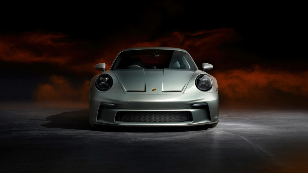 Sleek Silver Porsche 911 Wallpaper Against Dramatic Red Sky