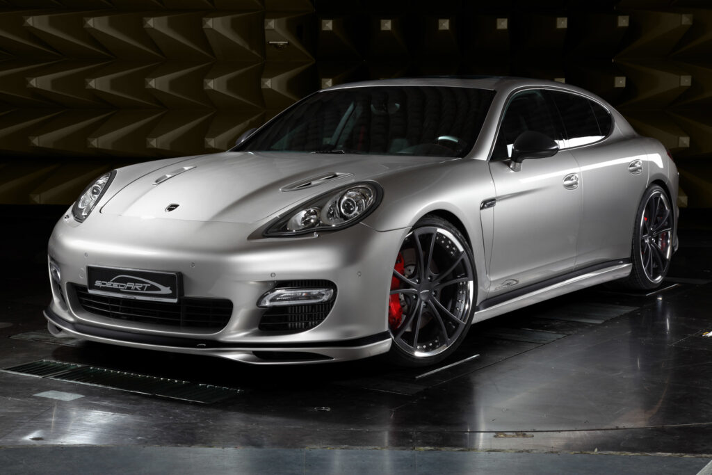 Sleek Silver Porsche Panamera Front View in Studio Wallpaper