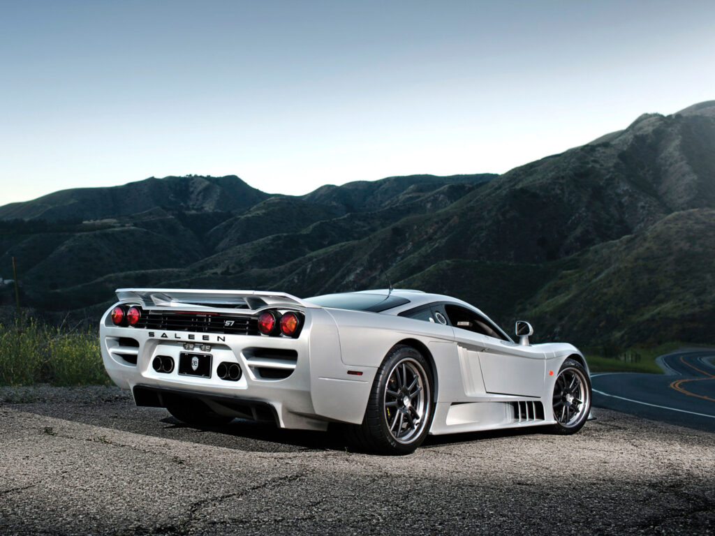 Sleek Silver Saleen S7: Rear View with Rolling Hills Background Wallpaper