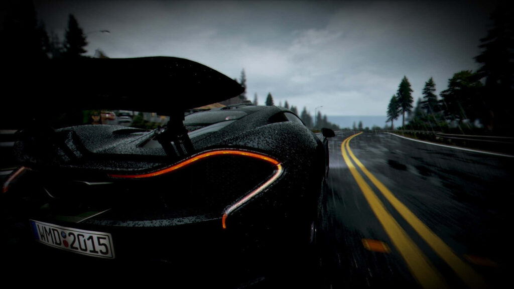 Sleek sports car racing on rain-soaked highway through tall pine trees in Need For Speed Most Wanted Wallpaper