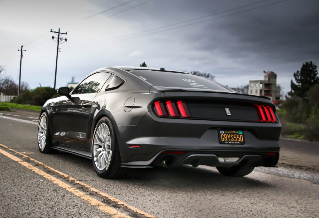 Sleek Sports Car Side View Wallpaper: Detailed Design & Dynamic Background