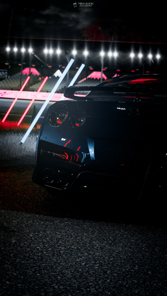 Sleek Sports Car at Night: Dramatic Glow & Reflections Wallpaper