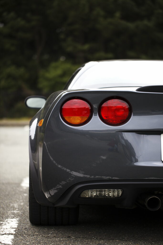 Stunning Sports Car Wallpaper: Rear View with Sleek Gray Design