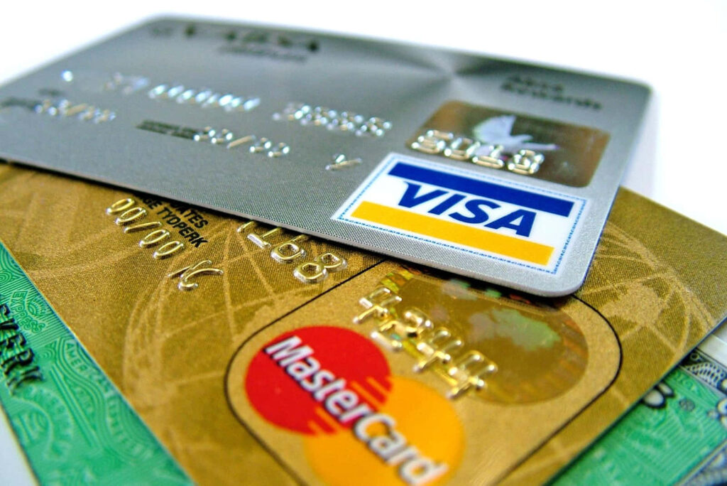 Close-up of stacked Visa and Mastercard credit cards with metallic design showcasing modern banking Wallpaper