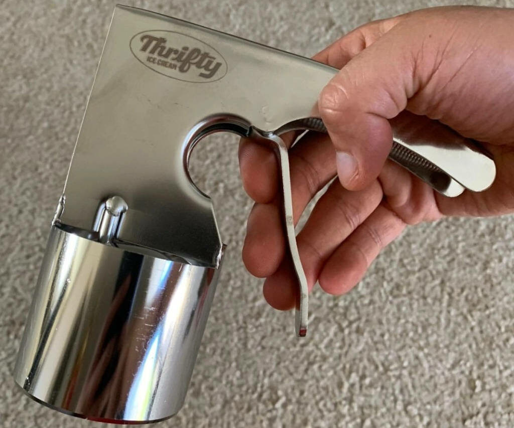 Thrifty Stainless Steel Ice Cream Scoop: Sleek & Durable Design Wallpaper